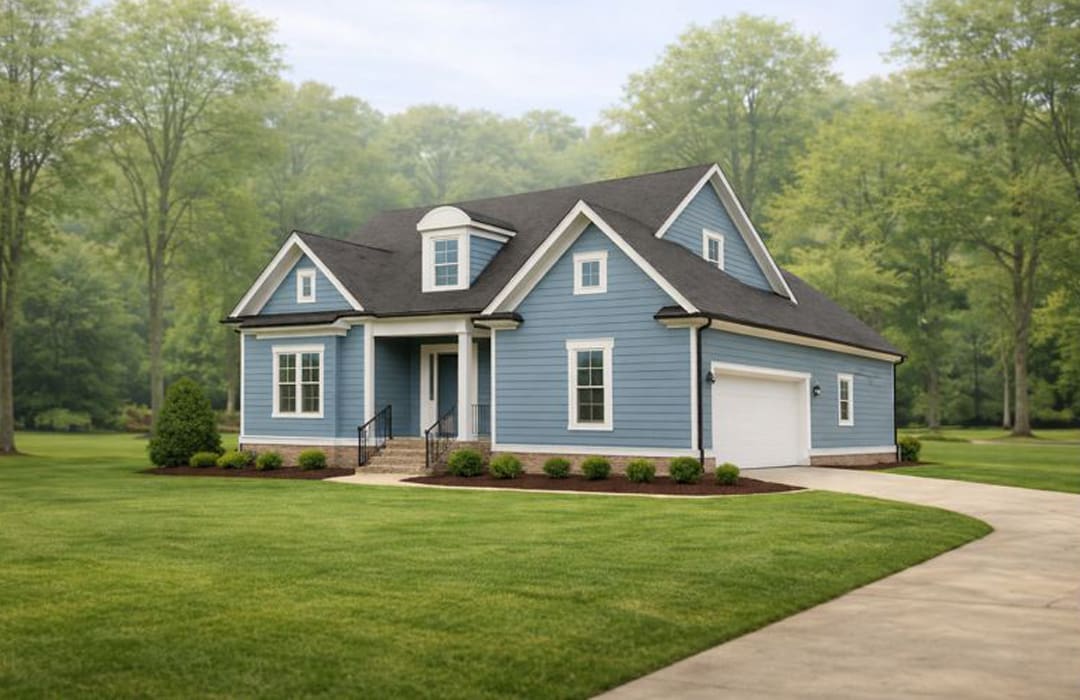 Lady-Street-Builders-Custom-Home A blue, single-family new construction home with white trim and a two-car garage, surrounded by a large green lawn and trees in the background.